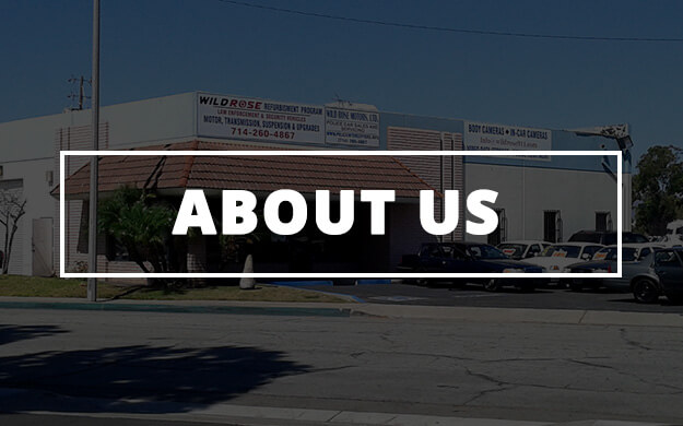 store front with sign and parking lot